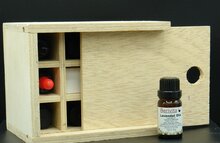 etherische olie in houten kistje